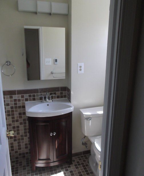 bathroom remodeling complete vanity and tile work floor and wall